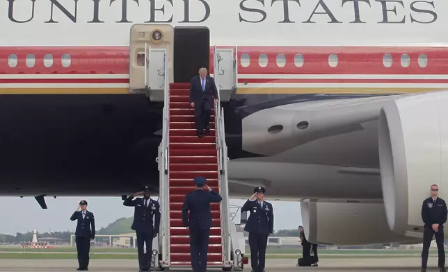 President Donald Trump walks down the stairs of Air Force One upon his arrival at Joint Base Andrews, Md, Friday, Aug. 28, 2026. (AP Photo/Luis M. Alvarez)