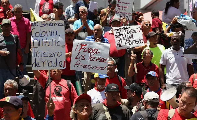 Venezuelans protest against President Donald Trump's deal giving the United States a stake in Venezuela’s oil reserves in Caracas, Saturday, Aug 29, 2026. (AP Photo/Pedro Mattey)