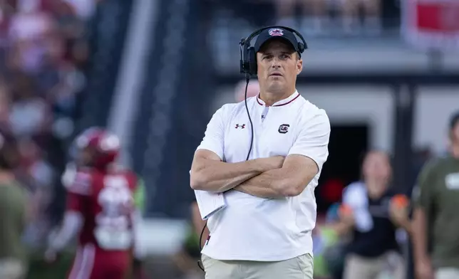 FILE - South Carolina head coach Shane Beamer watches a replay during the first half of an NCAA college football game against the Coastal Carolina, Saturday, Nov. 22, 2025, in Columbia, S.C. (AP Photo/Scott Kinser, File)