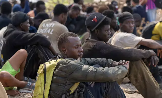 Migrants are detained by Moroccan security forces after attempting to cross from the border town of Fnideq to the Spanish enclave of Ceuta, Saturday, Aug. 15, 2026. (AP Photo)