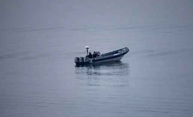Morocco security forces patrol near the Spanish-Moroccan border seen from the Spanish enclave of Ceuta, Saturday, Aug. 15, 2026. (AP Photo/Antonio Sempere)