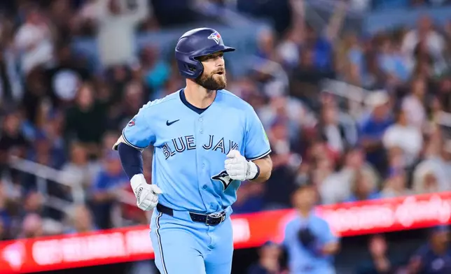 Toronto Blue Jays' Nathan Lukes reacts as he rounds the bases after hitting a three-run home run against the Kansas City Royals during the fourth inning of a baseball game in Toronto, Wednesday, Aug. 26, 2026. (Sammy Kogan/The Canadian Press via AP)
