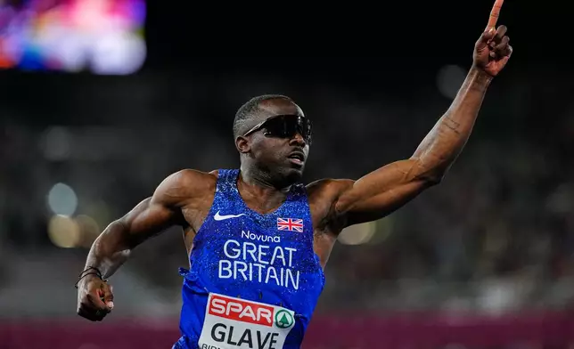 Britain's Romell Glave celebrates winning the gold medal in the men's 100 meters final at the European Athletics Championships in Birmingham, England, Tuesday, Aug. 11, 2026. (AP Photo/Petr David Josek)