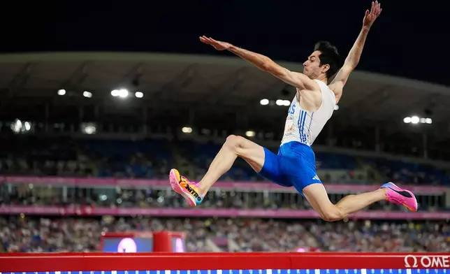 Greece's Miltiadis Tentoglou makes an attempt in the men's long jump final at the European Athletics Championships in Birmingham, England, Tuesday, Aug. 11, 2026. (AP Photo/Matthias Schrader)