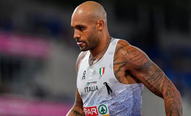 Italy's Lamont Marcell Jacobs leaves the track after the men's 100 meters final at the European Athletics Championships in Birmingham, England, Tuesday, Aug. 11, 2026. (AP Photo/Petr David Josek)