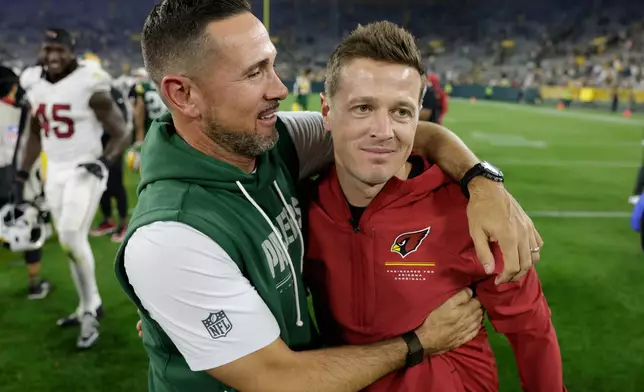Green Bay Packers head coach Matt LaFleur talks to Arizona Cardinals head coach Mike LaFleur after a preseason NFL football game Friday, Aug. 28, 2026, in Green Bay, Wis. (AP Photo/Matt Ludtke)