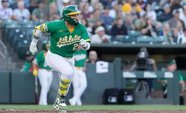 Athletics' Carlos Cortes runs after hitting a three-RBI double during the first inning of a baseball game against the Texas Rangers, Friday, Aug. 14, 2026, in West Sacramento, Calif. (AP Photo/Sara Nevis)