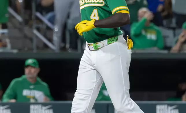 Athletics' Lawrence Butler runs the bases after hitting a home run during the seventh inning of a baseball game against the Texas Rangers Friday, Aug. 14, 2026, in West Sacramento, Calif. (AP Photo/Sara Nevis)