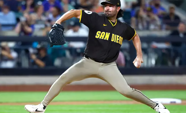 San Diego Padres' Robbie Ray (38) throws against the New York Mets during the fourth inning of a baseball game, Tuesday, Aug. 18, 2026, in New York. (AP Photo/Noah K. Murray)