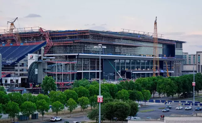 FILE - Construction continues on a new enclosed stadium for the Tennessee Titans NFL football team, May 18, 2026, in Nashville, Tenn. (AP Photo/George Walker IV, File)
