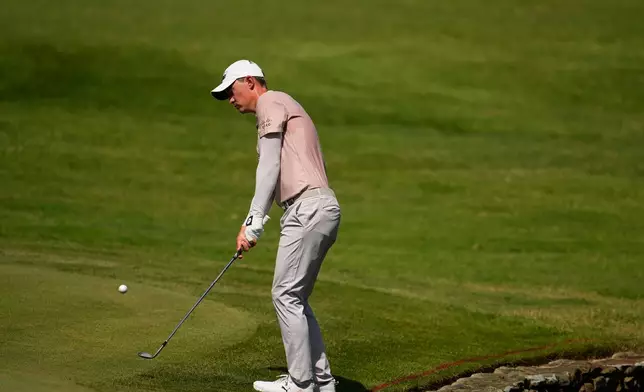 Maverick McNealy chips onto the fourth green during the second round of the St. Jude Championship golf tournament Friday, Aug. 14, 2026, in Memphis, Tenn. (AP Photo/George Walker IV)