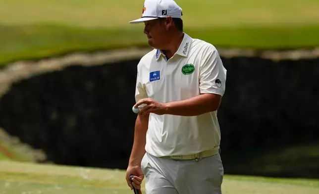 Sungjae Im, of South Korea, reacts to his putt on the fourth green during the final round of the St. Jude Championship golf tournament, Sunday, Aug. 16, 2026, in Memphis, Tenn. (AP Photo/George Walker IV)