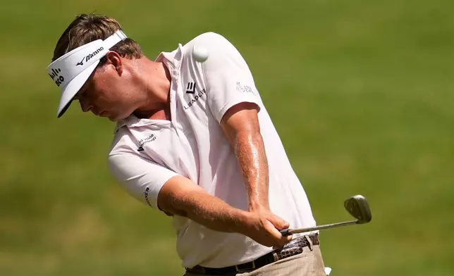 Keith Mitchell hits on the first hole during the third round of the St. Jude Championship golf tournament Saturday, Aug. 15, 2026, in Memphis, Tenn. (AP Photo/George Walker IV)