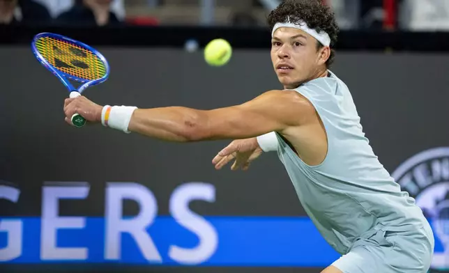 Ben Shelton of the United States hits a return to his compatriot Brandon Nakashima during the final tennis match of the National Bank Open in Montreal, Thursday, Aug. 13, 2026. (Christinne Muschi/The Canadian Press via AP)