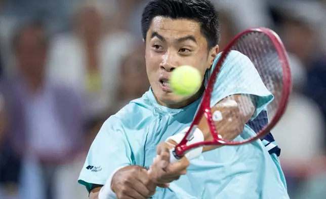 Brandon Nakashima of the United States hits a return to his compatriot Ben Shelton during final tennis match of the National Bank Open in Montreal, Thursday, Aug. 13, 2026. (Christinne Muschi/The Canadian Press via AP)
