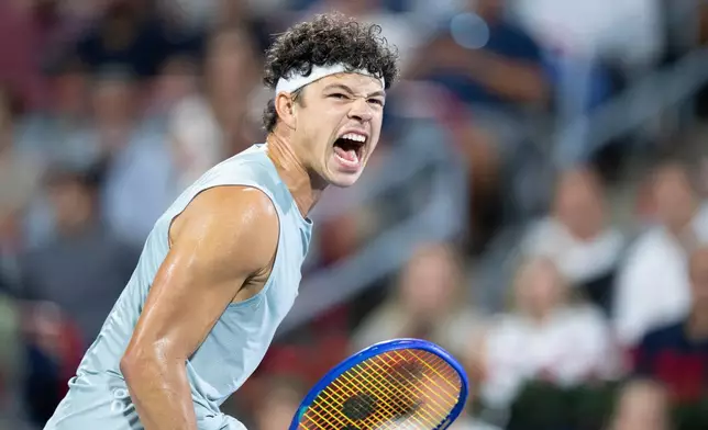 Ben Shelton of the United States reacts during his match against compatriot Brandon Nakashima during the final tennis match of the National Bank Open in Montreal, Thursday, Aug. 13, 2026. (Christinne Muschi/The Canadian Press via AP)