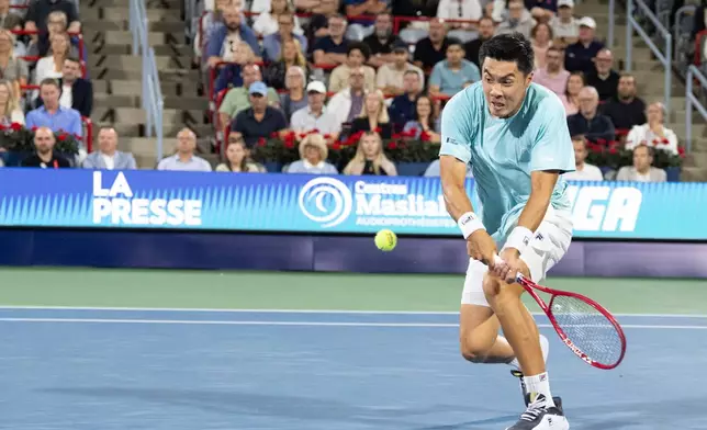 Brandon Nakashima of the United States hits a return to Ben Shelton during final tennis action at the National Bank Open in Montreal on Thursday, Aug. 13, 2026. (Christinne Muschi/The Canadian Press via AP)