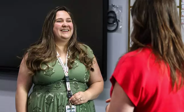 Elementary school teacher Emily Henderson speaks with the high school guidance counselor about back-to-school planning ahead of the school year at BASIS Flagstaff on Thursday, Aug. 6, 2026, in Flagstaff, Ariz. (AP Photo/Cheyanne Mumphrey)