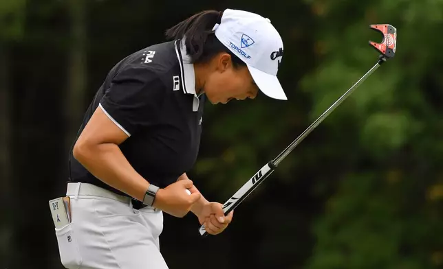 Ruoning Yin, of China, celebrates after sinking her final putt on the 18th green to win the LPGA FM Championship golf tournament, Sunday, Aug. 30, 2026, in Norton, Mass. (AP Photo/Steven Senne)