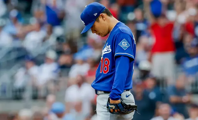 Los Angeles Dodgers pitcher Yoshinobu Yamamoto reacts after giving up a leadoff solo home run to Atlanta Braves' Drake Baldwin during the first inning of a baseball game, Thursday, Aug. 27, 2026, in Atlanta. (AP Photo/Erik S. Lesser)
