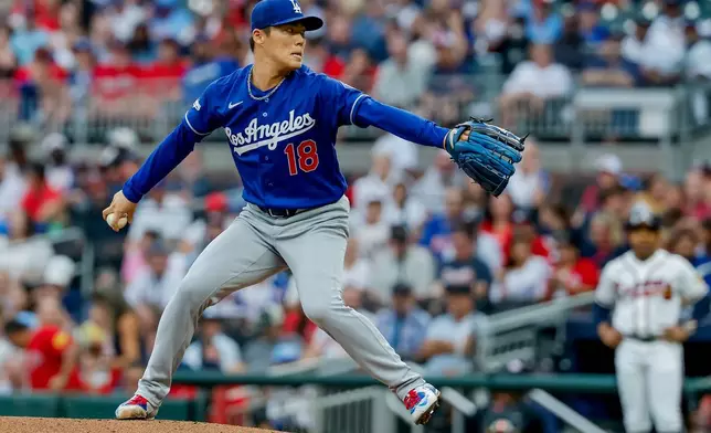 Los Angeles Dodgers pitcher Yoshinobu Yamamoto delivers to an Atlanta Braves batter during the first inning of a baseball game, Thursday, Aug. 27, 2026, in Atlanta. (AP Photo/Erik S. Lesser)