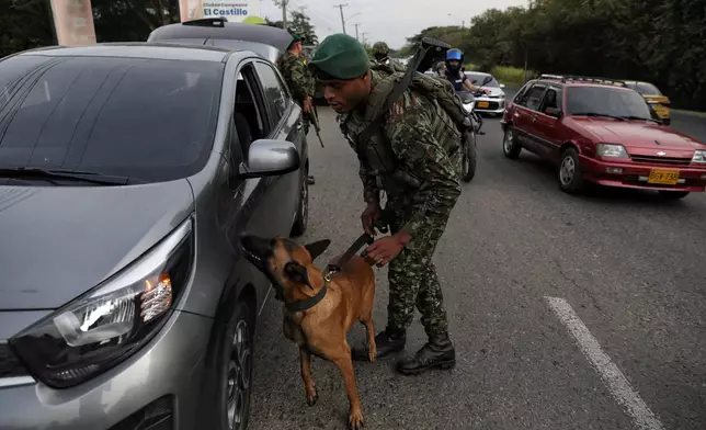 Soldiers inspect a car at a security checkpoint ahead of the inauguration of President-elect Abelardo de la Espriella in Cali, Colombia, Wednesday, Aug. 5, 2026. (AP Photo/Santiago Saldarriaga)