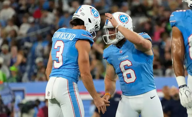 Tennessee Titans kicker Joey Slye (6) celebrates with teammate Tommy Townsend (3) after kicking a field goal during the first half of a preseason NFL football game against the Seattle Seahawks, Sunday, Aug. 23, 2026, in Nashville, Tenn. (AP Photo/George Walker IV)