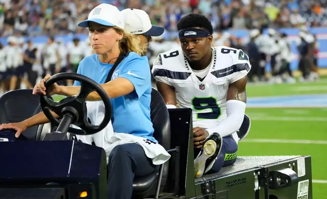 Seattle Seahawks defensive back Bud Clark (9) is carted off the field after getting injured during the first half of a preseason NFL football game against the Tennessee Titans, Sunday, Aug. 23, 2026, in Nashville, Tenn. (AP Photo/George Walker IV)