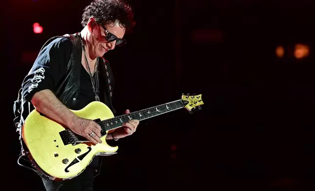 FILE - Neal Schon, of Journey, performs in Canton, Ohio, on Aug. 6, 2022. (AP Photo/David Dermer, File)