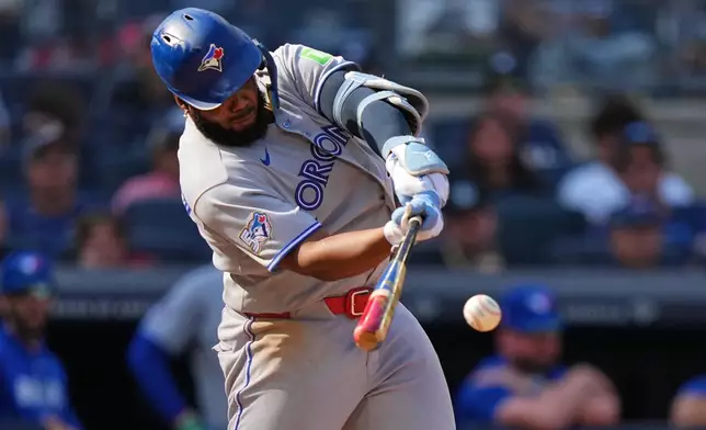Toronto Blue Jays' Vladimir Guerrero Jr. hits a single during the eighth inning of a baseball game against the New York Yankees Saturday, Aug. 22, 2026, in New York. (AP Photo/Frank Franklin II)