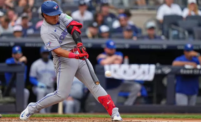 Toronto Blue Jays' Kazuma Okamoto hits a ground-rule double during the fourth inning of a baseball game against the New York Yankees Saturday, Aug. 22, 2026, in New York. (AP Photo/Frank Franklin II)
