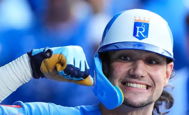 Kansas City Royals' Jac Caglianone celebrates in the dugout after hitting a two-run home run during the seventh inning of a baseball game against the Chicago Cubs, Saturday, Aug. 8, 2026, in Kansas City, Mo. (AP Photo/Charlie Riedel)