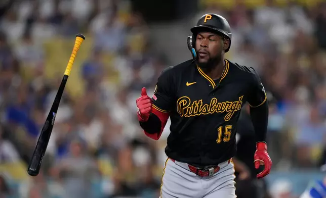 Pittsburgh Pirates' Oneil Cruz tosses his bat after hitting a two-run home run during the eighth inning of a baseball game against the Los Angeles Dodgers, Friday, Aug. 21, 2026, in Los Angeles. (AP Photo/Mark J. Terrill)