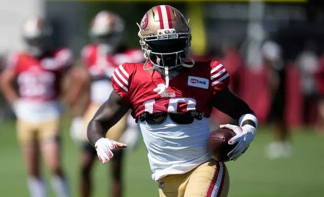 San Francisco 49ers wide receiver Deebo Samuel Sr. runs during the NFL football team's training camp, Saturday, Aug. 1, 2026, in Santa Clara, Calif. (AP Photo/Jeff Chiu)