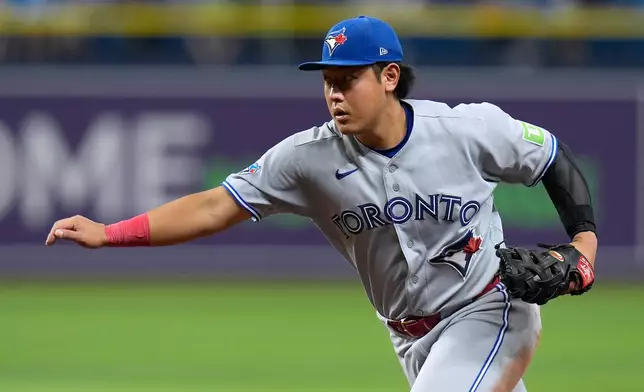 Toronto Blue Jays first baseman Kazuma Okamoto, of Japan, races Tampa Bay Rays' Richie Palacios to the base during the sixth inning of a baseball game Wednesday, Aug. 19, 2026, in St. Petersburg, Fla. (AP Photo/Chris O'Meara)