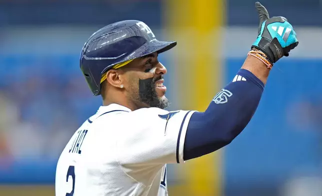 Tampa Bay Rays' Yandy Díaz celebrates his two-run home run off Toronto Blue Jays pitcher Max Scherzer during the first inning of a baseball game Wednesday, Aug. 19, 2026, in St. Petersburg, Fla. (AP Photo/Chris O'Meara)
