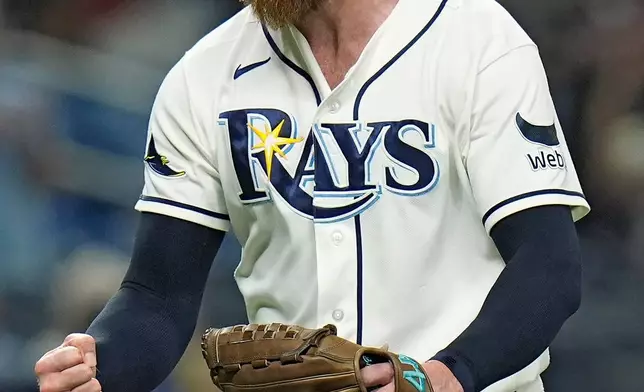 Tampa Bay Rays pitcher Bryan Baker reacts after closing out the Toronto Blue Jays during the ninth inning of a baseball game Wednesday, Aug. 19, 2026, in St. Petersburg, Fla. (AP Photo/Chris O'Meara)