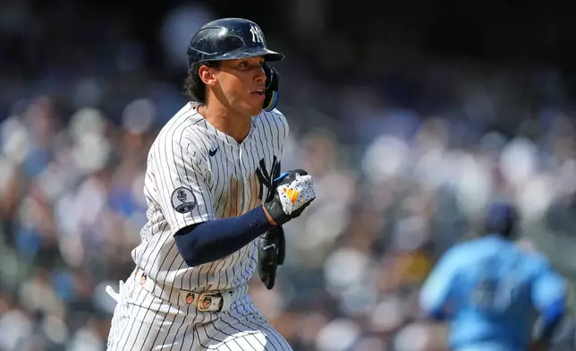 New York Yankees' George Lombard Jr. hits a single during the sixth inning of a baseball game against the Toronto Blue Jays Sunday, Aug. 23, 2026, in New York. (AP Photo/Frank Franklin II)