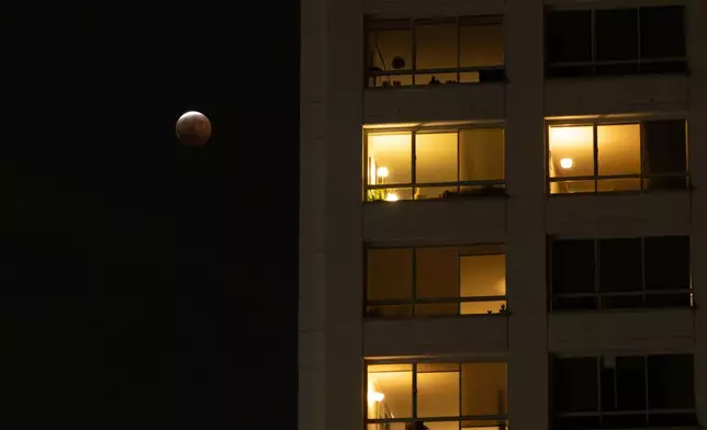 A partial lunar eclipse is seen in Los Angeles, Thursday, Aug. 27, 2026. (AP Photo/Jae C. Hong)