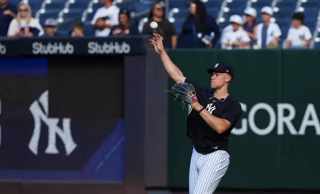 New York Yankees' Aaron Judge throws on the field before a baseball game against the Houston Astros Tuesday, Aug. 25, 2026, in New York. (AP Photo/Frank Franklin II)