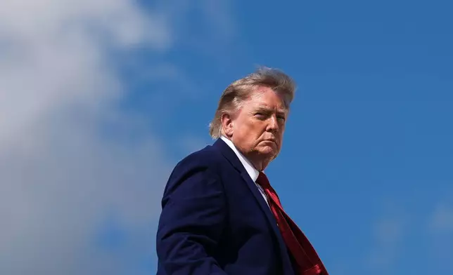President Donald Trump boards Air Force One, Friday, Aug. 7, 2026, at Joint Base Andrews, Md. (AP Photo/Julia Demaree Nikhinson)