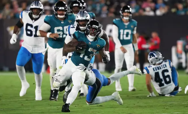 Jacksonville Jaguars running back Ameer Abdullah runs against the Carolina Panthers during the first half of an NFL preseason football game, Friday, Aug. 21, 2026, in Jacksonville, Fla. (AP Photo/Kelly Jordan)
