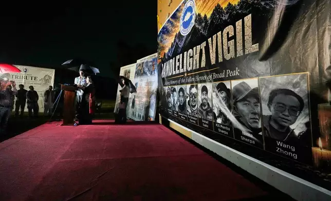 Nepalese Ambassador to Pakistan Rita Dhital, center, delivers her speech during a candlelight vigil in memory of 10 climbers who lost their lives on Broad Peak, in Islamabad, Pakistan, Tuesday, Aug. 11, 2026. (AP Photo/Anjum Naveed)