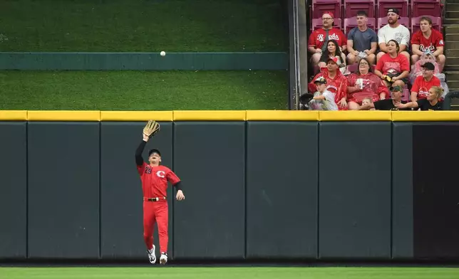 Cincinnati Reds center fielder TJ Friedl fields a fly ball by Pittsburgh Pirates' Bryan Reynolds during the first inning of a baseball game in Cincinnati, Saturday, Aug. 1, 2026. (AP Photo/Tanner Pearson)