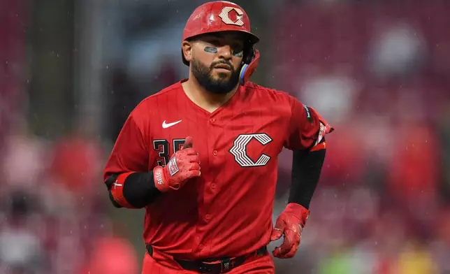 Cincinnati Reds' Jose Trevino rounds the bases after hitting a solo home run during the fifth inning of a baseball game against the Pittsburgh Pirates in Cincinnati, Saturday, Aug. 1, 2026. (AP Photo/Tanner Pearson)