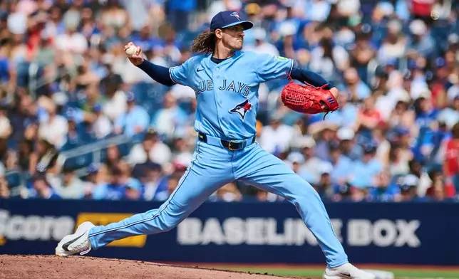 Toronto Blue Jays' Kevin Gausman (34) works against the St. Louis Cardinals during the first inning of a baseball game in Toronto, Saturday, Aug. 1, 2026. (Sammy Kogan/The Canadian Press via AP)