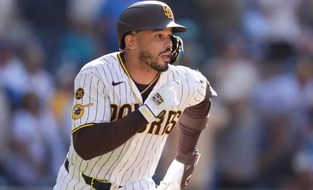 San Diego Padres' Luis Campusano, runs after hitting a walk off single to defeat the Brewers during the eleventh inning of a baseball game Wednesday, Aug. 12, 2026, in San Diego. (AP Photo/Gregory Bull)