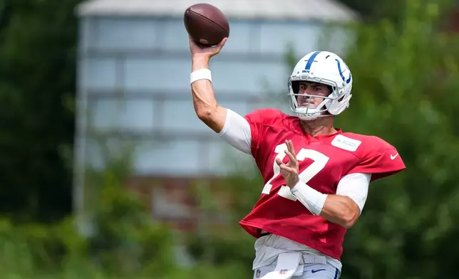 Indianapolis Colts quarterback Daniel Jones (17) throws during a joint practice with the Atlanta Falcons at the team's NFL football training camp in Westfield, Ind., Wednesday, Aug. 19, 2026. (AP Photo/Michael Conroy)