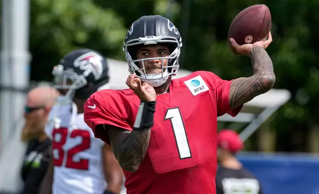 Atlanta Falcons quarterback Tua Tagovailoa (1) throws during a joint practice with the Indianapolis Colts at the team's NFL football training camp in Westfield, Ind., Wednesday, Aug. 19, 2026. (AP Photo/Michael Conroy)