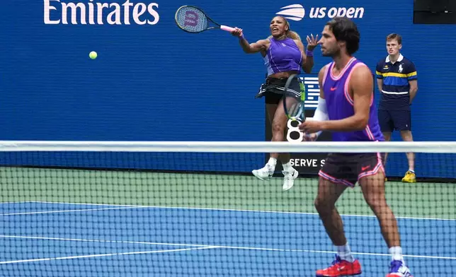 Serena Williams, of the United States, hits the ball during a mixed doubles match at the U.S. Open tennis championships, Tuesday, Aug. 25, 2026, in New York. (AP Photo/Sydney Schaefer)
